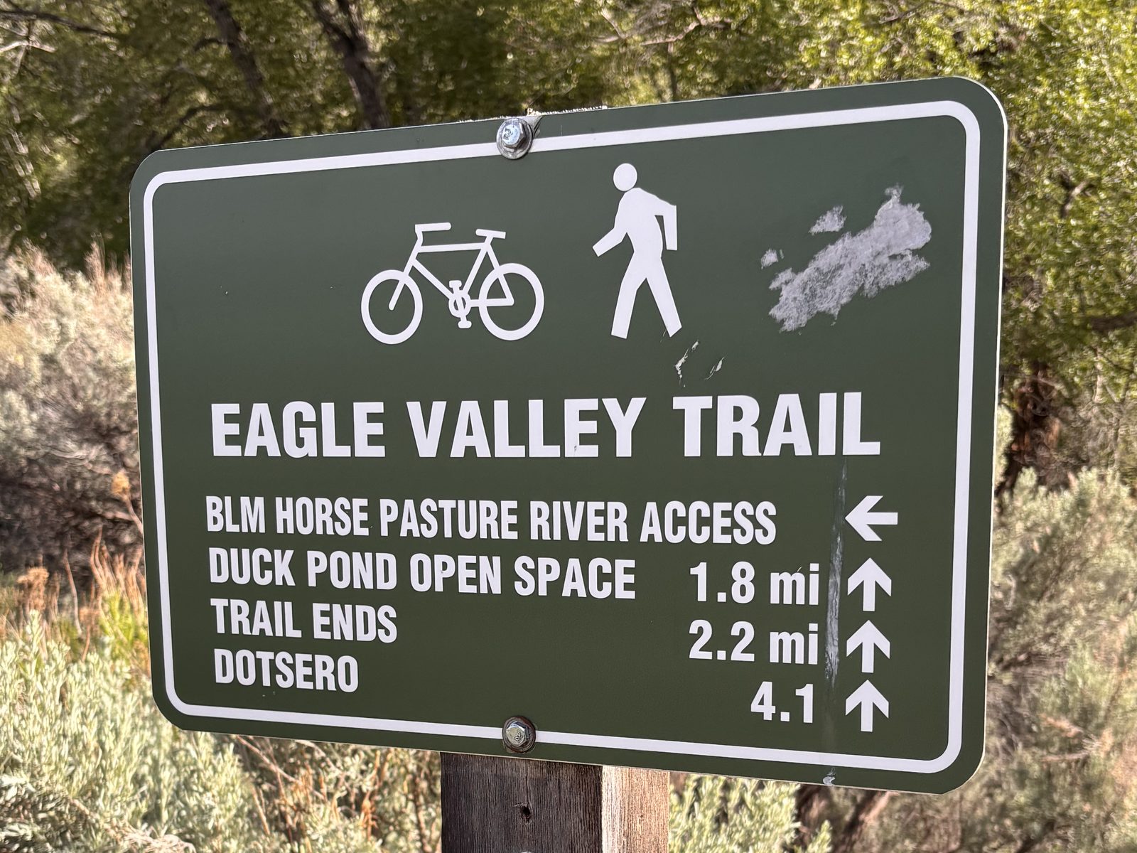 An Eagle Valley Trail sign west of Gypsum pointing to BLM Horse Pasture River Access, Duck Pond Open Space, and Dotsero